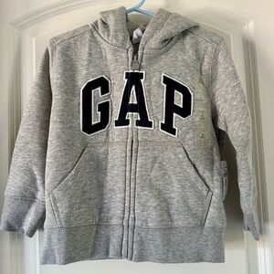 NWT Baby Gap size 2 logo hooded sweatshirt with pockets. Soft and fuzzy inside!